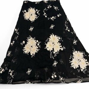 Persaman black midi skirt with white floral embroidery